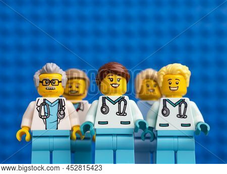 Tambov, Russian Federation - February 12, 2022 Five Lego Doctor Minifigures Standing Against A Blue 