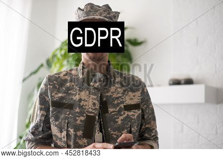 Gdpr - General Data Protection Regulations Military Concept. Soldier Offers A Padlock With Gdpr Word
