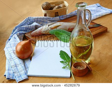 Opened Notebook And Ingredients For Lean Fish Dinner