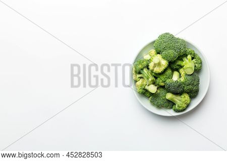 Broccoli Of Fresh Green Broccoli In Bowl Over Coloredbackground. , Close Up. Fresh Vegetable.