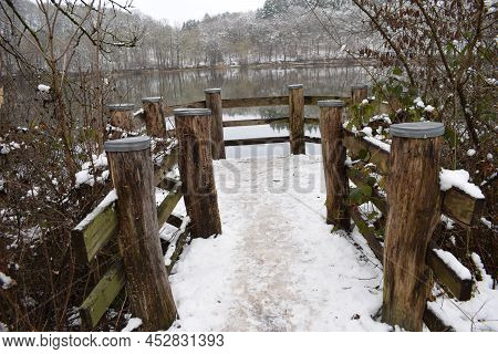 Snowy Wooden Platform In The Lake, Very Slippery