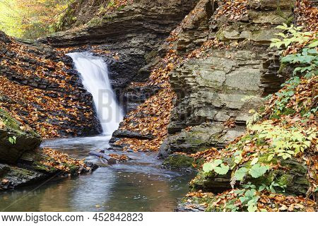 Nature Landscape With Leaf Fall On Waterfall  In Mountain Gorge On Turichka River. Lumshory Village 