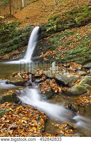 Autumn Nature Landscape With Leaf Fall On Waterfall  Krutylo In Mountain Gorge On Turichka River. Lu