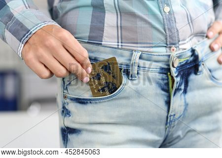 Close-up Of Woman Hold Credit Card In Jeans Pocket, Use Card For Contactless Payment, Online Transac