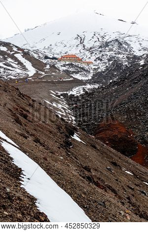 The  Snowy Slope Of Cotopaxi Volcano And Refuge Located On Altitud 4864 M Above The Sea Level. Cotop