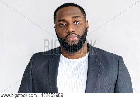 Headshot Portrait Of Influential Stylish African American Male Boss. Confident Young Adult Businessm
