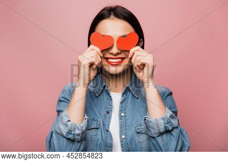 Woamn In Love. Happy Caucasian Young Woman In Love, Dressed In Casual Wear, Covers Her Eyes With Hea