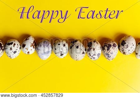 Minimal Easter Concept. Qual Spotted Easter Eggs Row On Yellow Background. Easter Card With Copy Spa