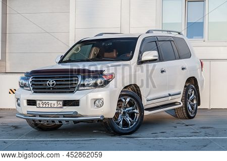 Novosibirsk, Russia - 04. 12. 2022: Front View Of Toyota Land Cruiser 200 J200 2013 Year White Color