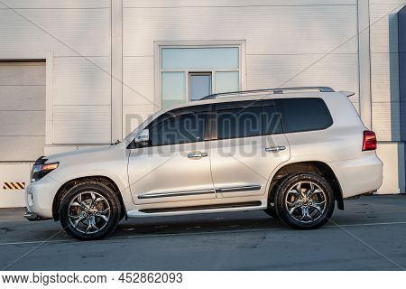 Novosibirsk, Russia - 04. 12. 2022: Side View Of Toyota Land Cruiser 200 J200 2013 Year White Color 