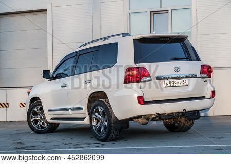 Novosibirsk, Russia - 04. 12. 2022: Rear View Of Toyota Land Cruiser 200 J200 2013 Year White Color 