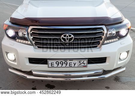 Novosibirsk, Russia - 04. 12. 2022: Front View Of Toyota Land Cruiser 200 J200 2013 Year White Color