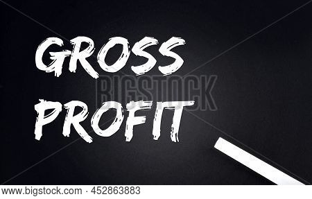 Gross Profit Text On Black Chalkboard With A Piece Of Chalk
