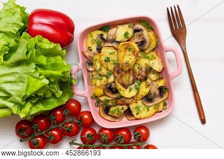 Homemade Baked Boulanger On A Wooden Table With Cherry Tomatoes And Lettuce Leaves. Delicious Europe