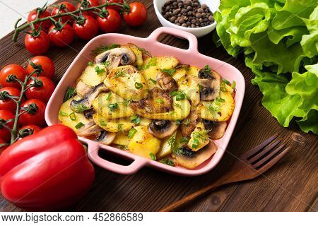 Tartiflet With Bacon, Herbs And Vegetables At Home On A Wooden Background. View From Above.