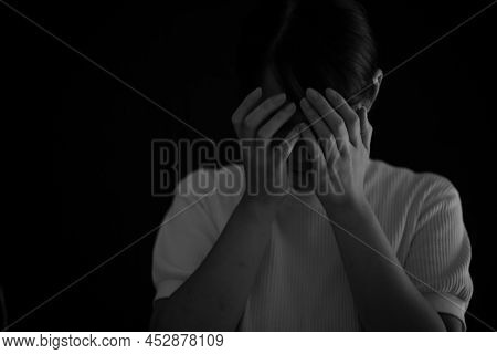 Woman Covering Her Face With Her Hands