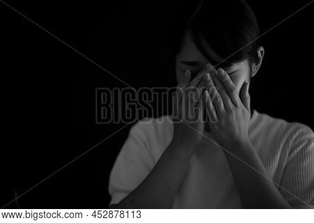 Woman Covering Her Face With Her Hands