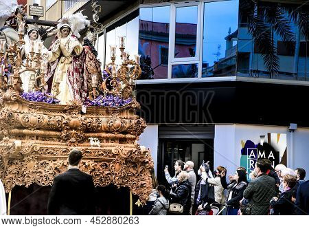 Elche, Spain- April 13, 2022: Easter Parade With Bearers And Penitents Through The Streets Of Elche 