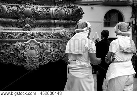 Elche, Spain- April 13, 2022: Bearers Of Easter Parade Through The Streets Of Elche City In The Holy