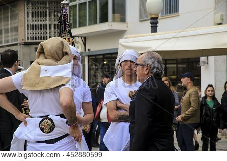 Elche, Spain- April 13, 2022: Bearers Of Easter Parade Through The Streets Of Elche City In The Holy