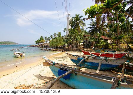 Fisherman Boats And Beautiful White Lighthouse Dondra Head, Sri Lanka