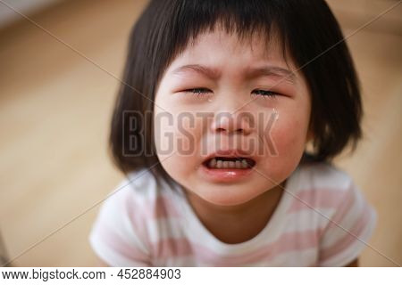 Image Of A Girl Crying At Home
