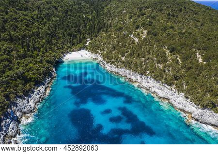 Aerial Top Down View Of Dafnoudi Beach In Kefalonia, Greece. Remote Bay With Pure Crystal Clean Turq
