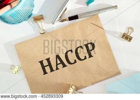 Haccp Hazard Analysis And Critical Control Points Text Printed On Crafted Paper On Office Desk Backg