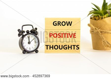 Grow Positive Thoughts Symbol. Concept Words Grow Positive Thoughts On Blocks. Beautiful White Backg