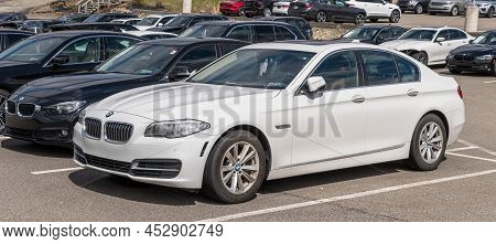 Monroeville, Pennsylvania, Usa April 10, 2022 A White Bmw Sedan At A Dealership On A Sunny Spring Da