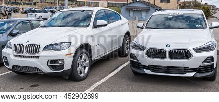 Monroeville, Pennsylvania, Usa April 10, 2022 Two Different Models Of White Bmw Vehicles For Sale At