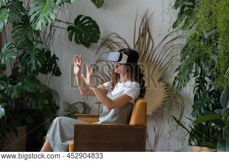 Overjoyed Young Woman Wear Vr Glasses Simulator Enjoy Experience From Virtual Reality Headset For Au