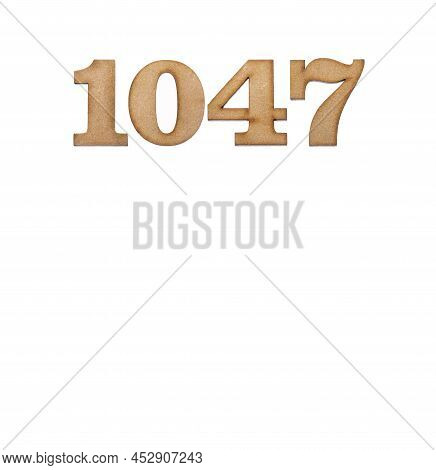 Number 1047 In Wood, Isolated On White Background