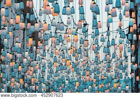Street Lights On Stoleshnikov Lane. Moscow Pedestrian Street. Lights In The Sunset. Beautiful Backli