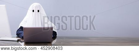 Ghostwriter Writing Article On Laptop In Office
