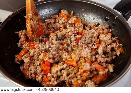 Preparation Of Ground Beef With The Traditional Colombian Hogao Or Criollo Sauce (salsa Criolla) Mad