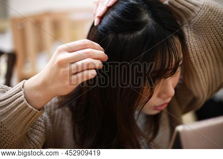 Image Of A Woman Who Cares About Her Hair