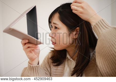 Image Of A Woman Who Cares About Her Hair