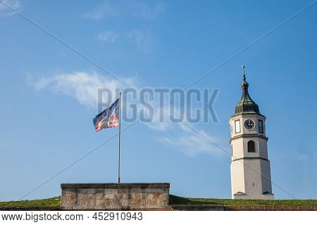 Flag With The Coat Of Arms Of Belgrade Next To Clock Tower Of Kalemegdan, Also Known As Sahat Kula, 