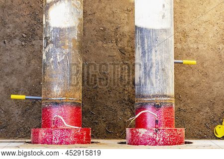 Laying Of Underground Pipes In Concrete Chamber. Installation Of Water Main At The Construction Site