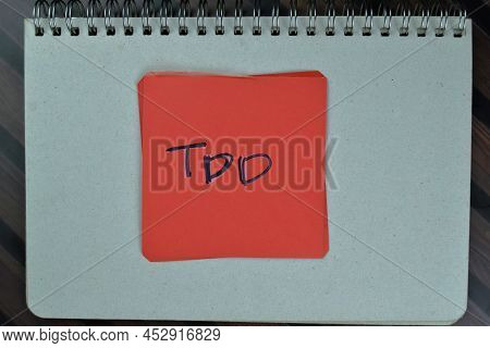 Tdd Write On Sticky Notes Isolated On Wooden Table.