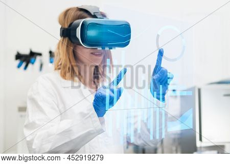 Scientist In Lab Coat And Virtual Reality Vr Goggle Uses Ar Augmented Reality For Analysis Of Data. 