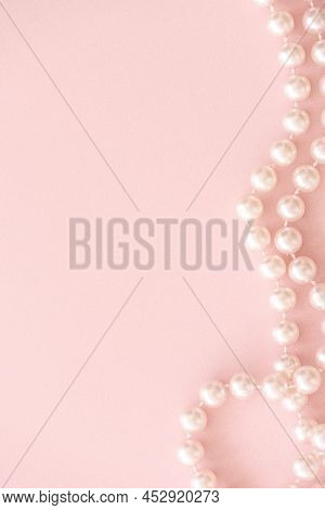 Vertical Pastel Mockup With Pearls Bead On Pink Background With Copy Space.