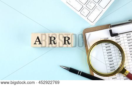Arr Word On A Wooden Cubes On Blue Background With Chart And Keyboard