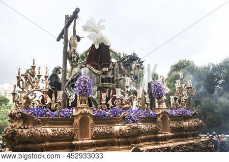 Elche, Spain- April 13, 2022: Easter Parade With Bearers And Penitents Through The Streets Of Elche 
