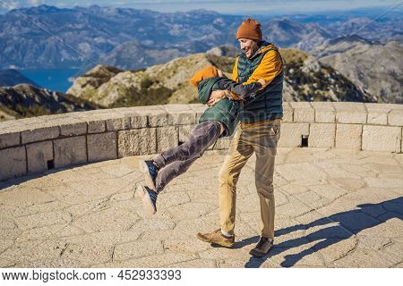 Dad And Son Travellers In Mountain Landscape At National Park Lovcen, Montenegro. Travel To Monteneg