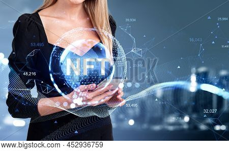 Businesswoman With Mobile Phone In Hands. Non-fungible Token Hologram With Earth Globe, Glowing Line
