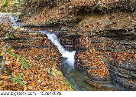 Nature Landscape With Leaf Fall On Waterfall  In Mountain Gorge On Turichka River. Lumshory Village 