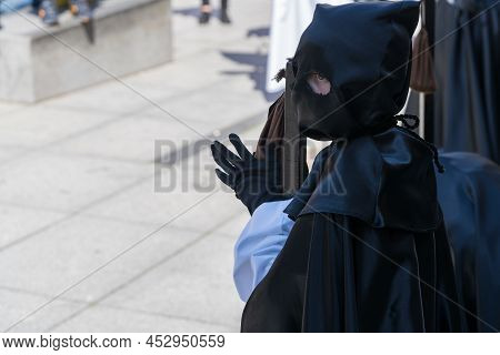 Cofrade Parading In The Holy Week Procession In The City Of Aviles In Asturias.