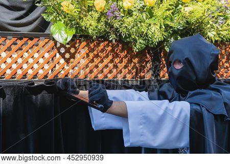 Cofrade Parading In The Holy Week Procession In The City Of Aviles In Asturias.